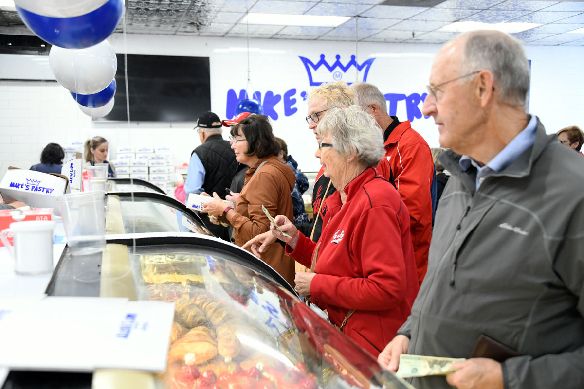 134 Fun Club travelers ponder what flavor of cannoli to purchase.jpg